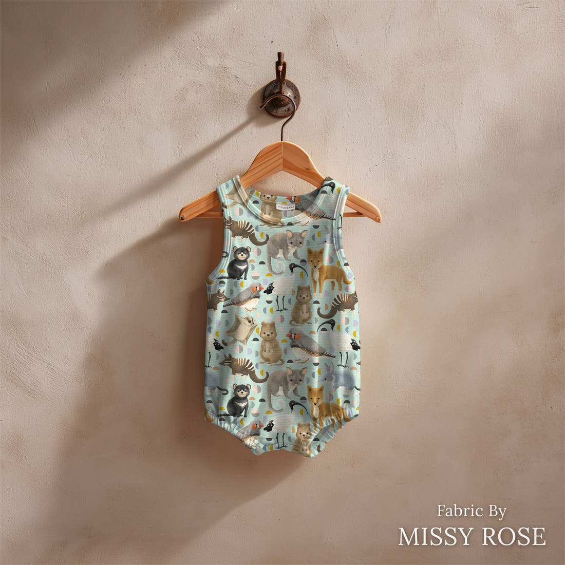 Design 401 Light Blue Australian Animals Fabric sewn into a baby romper – see how the print looks made up | Fabric by Missy Rose