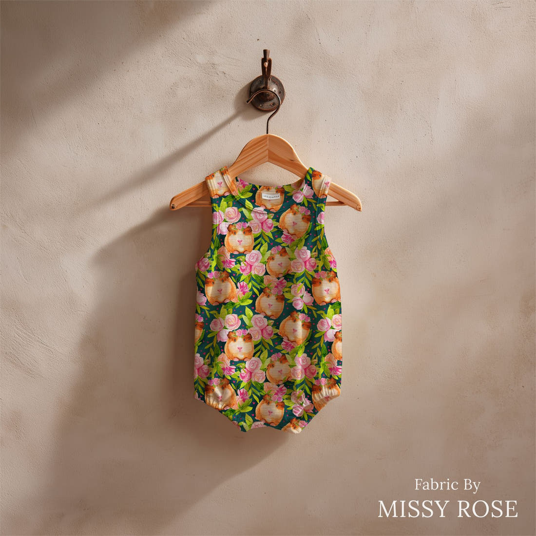 Design 430 Guinea Pig Fabric sewn into a baby romper – see how the print looks made up | Fabric by Missy Rose