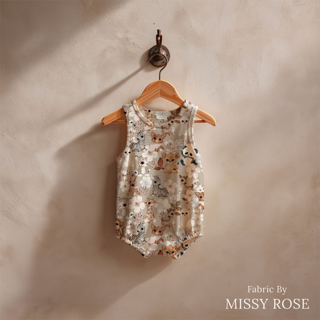 Design 442 Neutral Safari Animals Fabric sewn into a baby romper – see how the print looks made up | Fabric by Missy Rose
