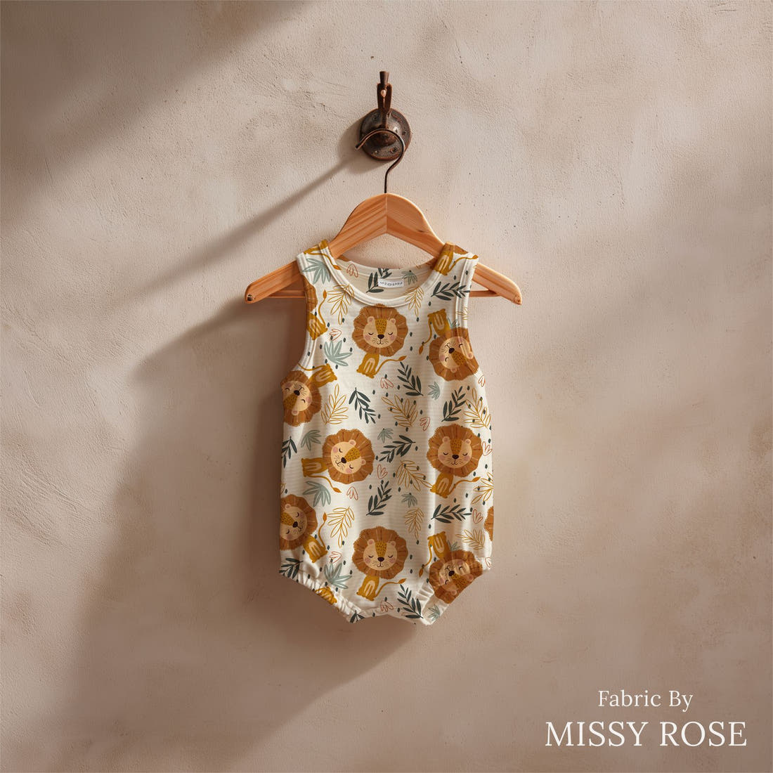 Design 456 Lion Fabric sewn into a baby romper – see how the print looks made up | Fabric by Missy Rose