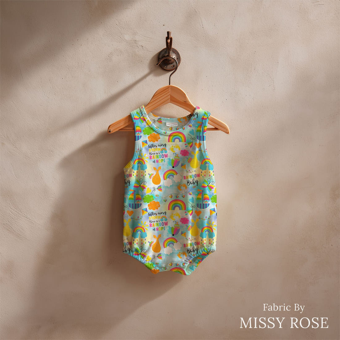 Design 498 Rainbow Baby Fabric sewn into a baby romper – see how the print looks made up | Fabric by Missy Rose
