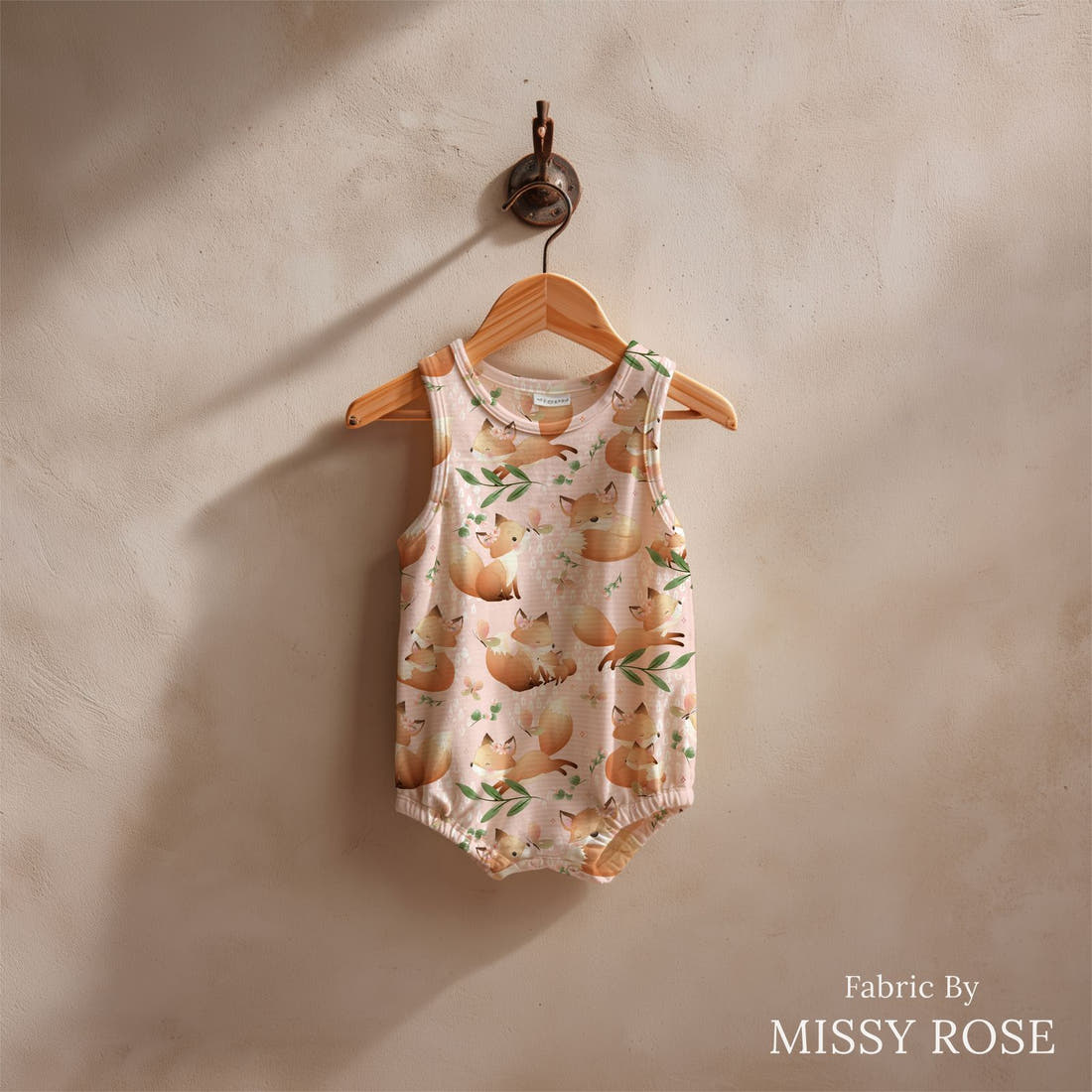 Design 535 Pink Fox Fabric sewn into a baby romper – see how the print looks made up | Fabric by Missy Rose