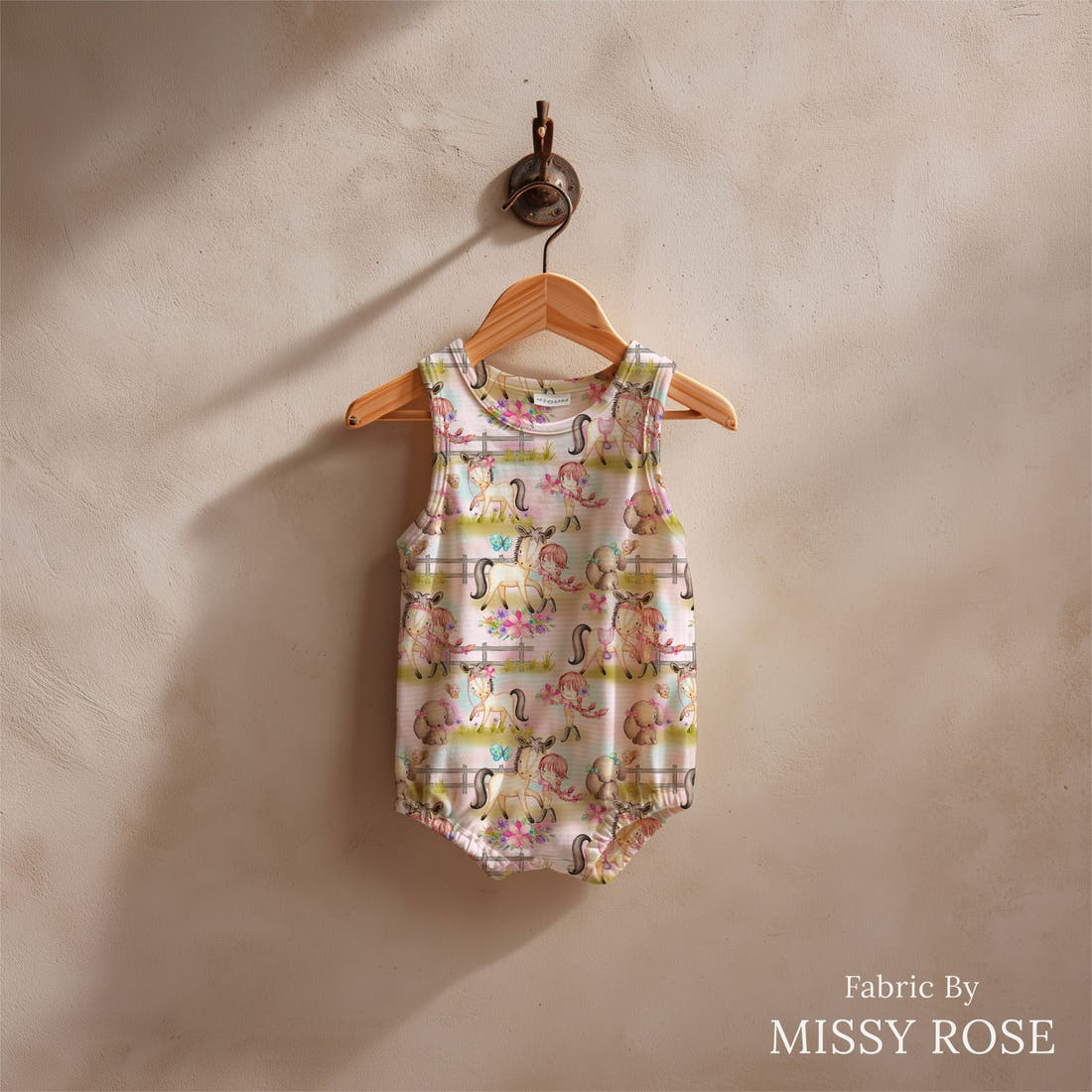 Design 552 Pink Pony Fabric sewn into a baby romper – see how the print looks made up | Fabric by Missy Rose