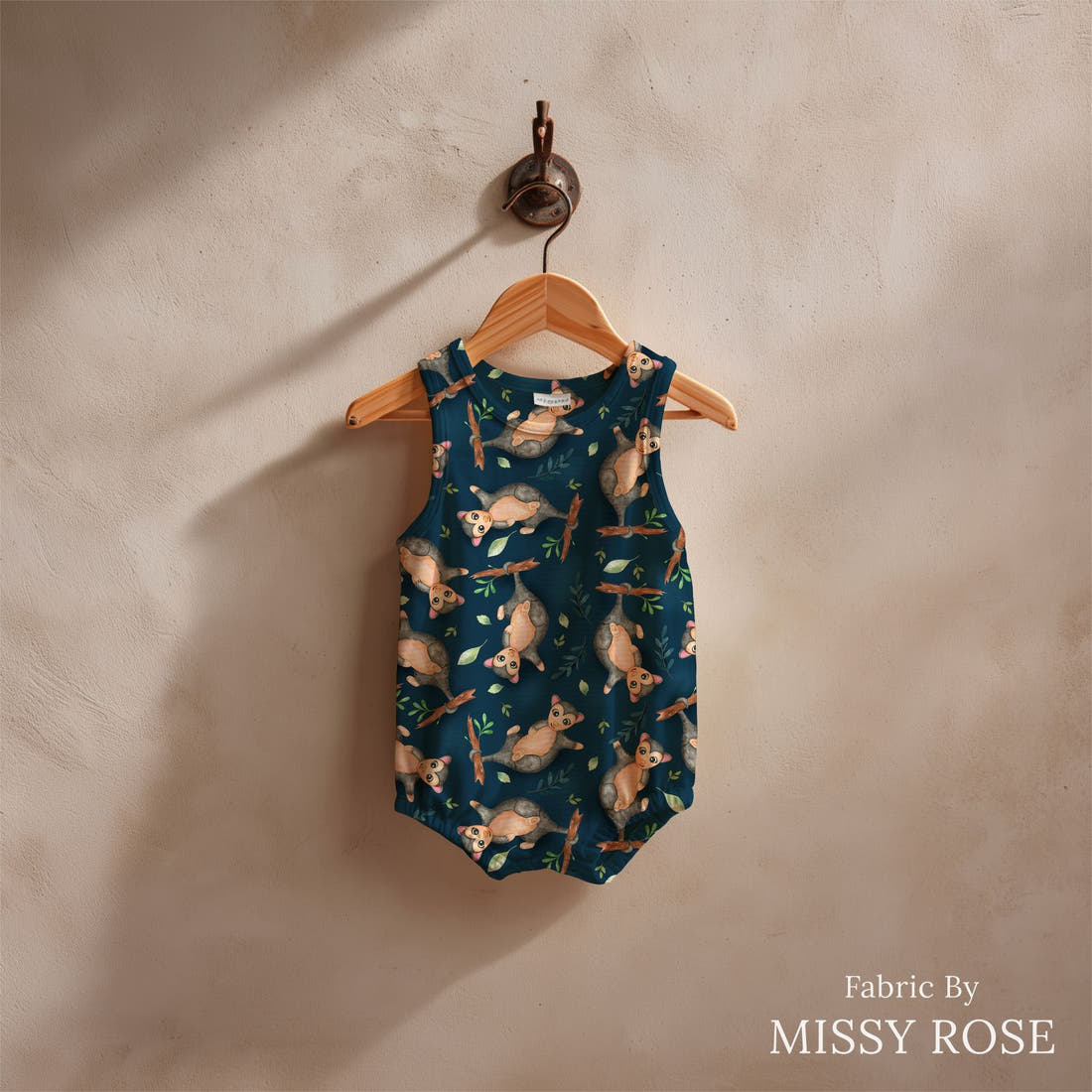 Design 553 Navy Possum Fabric sewn into a baby romper – see how the print looks made up | Fabric by Missy Rose