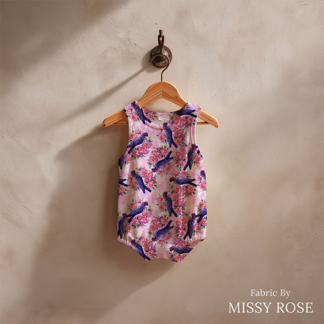 Design 559 Black Cockatoo Fabric sewn into a baby romper – see how the print looks made up | Fabric by Missy Rose