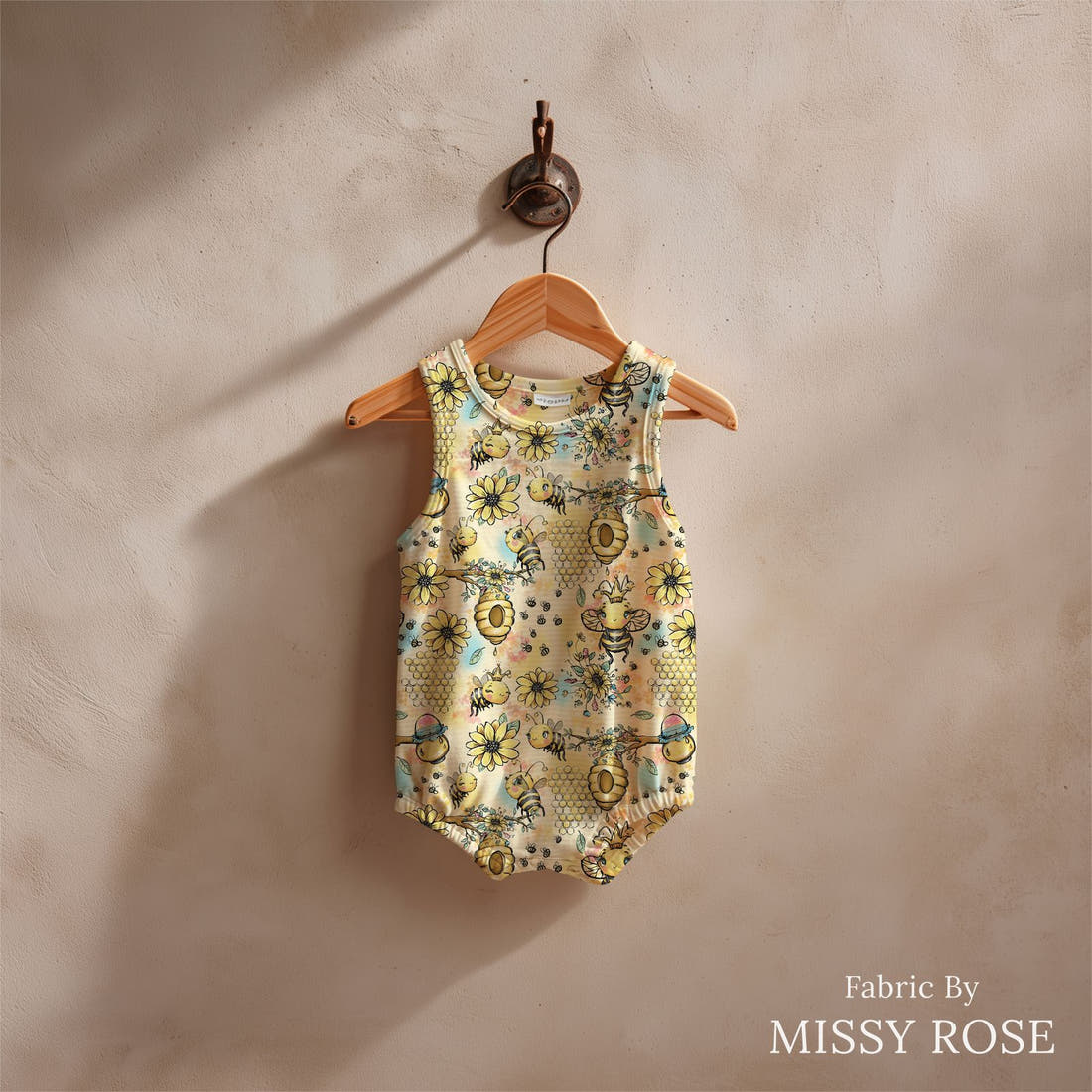 Design 573 Yellow Bee Fabric sewn into a baby romper – see how the print looks made up | Fabric by Missy Rose