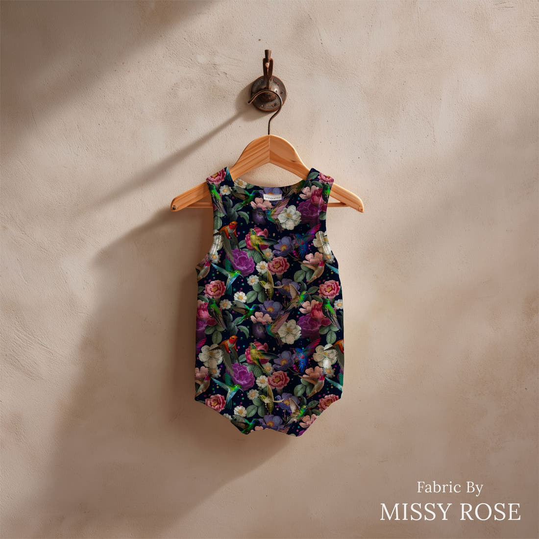 Design 574 Navy Hummingbird Fabric sewn into a baby romper – see how the print looks made up | Fabric by Missy Rose
