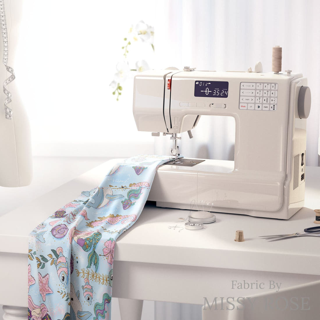 Design 588 Mermaid Dolphin Fabric on a sewing machine – premium fabric for sewing projects | Fabric by Missy Rose