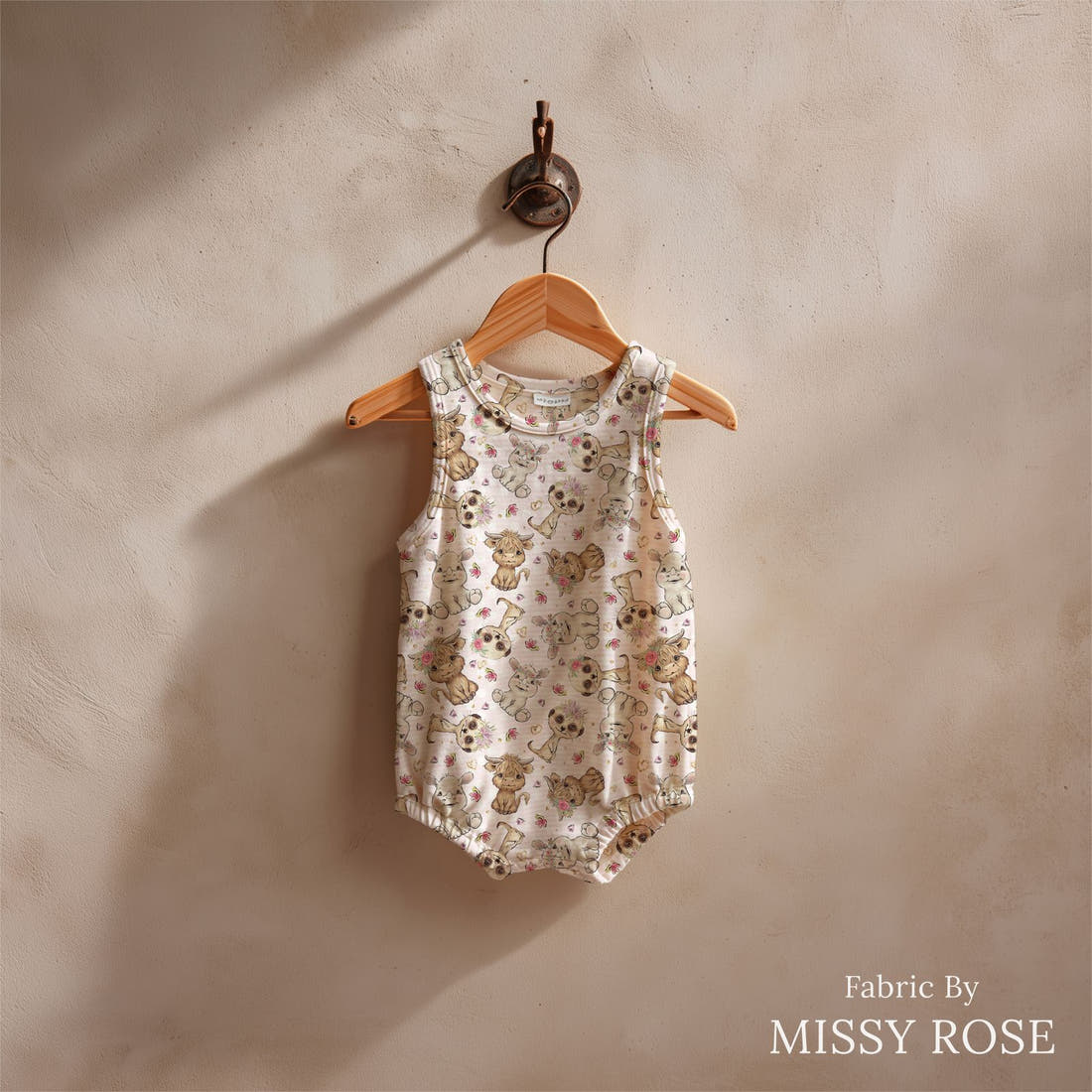 Design 6 Pink African Animals Fabric sewn into a baby romper – see how the print looks made up | Fabric by Missy Rose