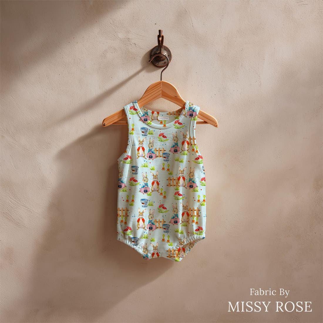 Design 604 Blue Rabbit Fabric sewn into a baby romper – see how the print looks made up | Fabric by Missy Rose