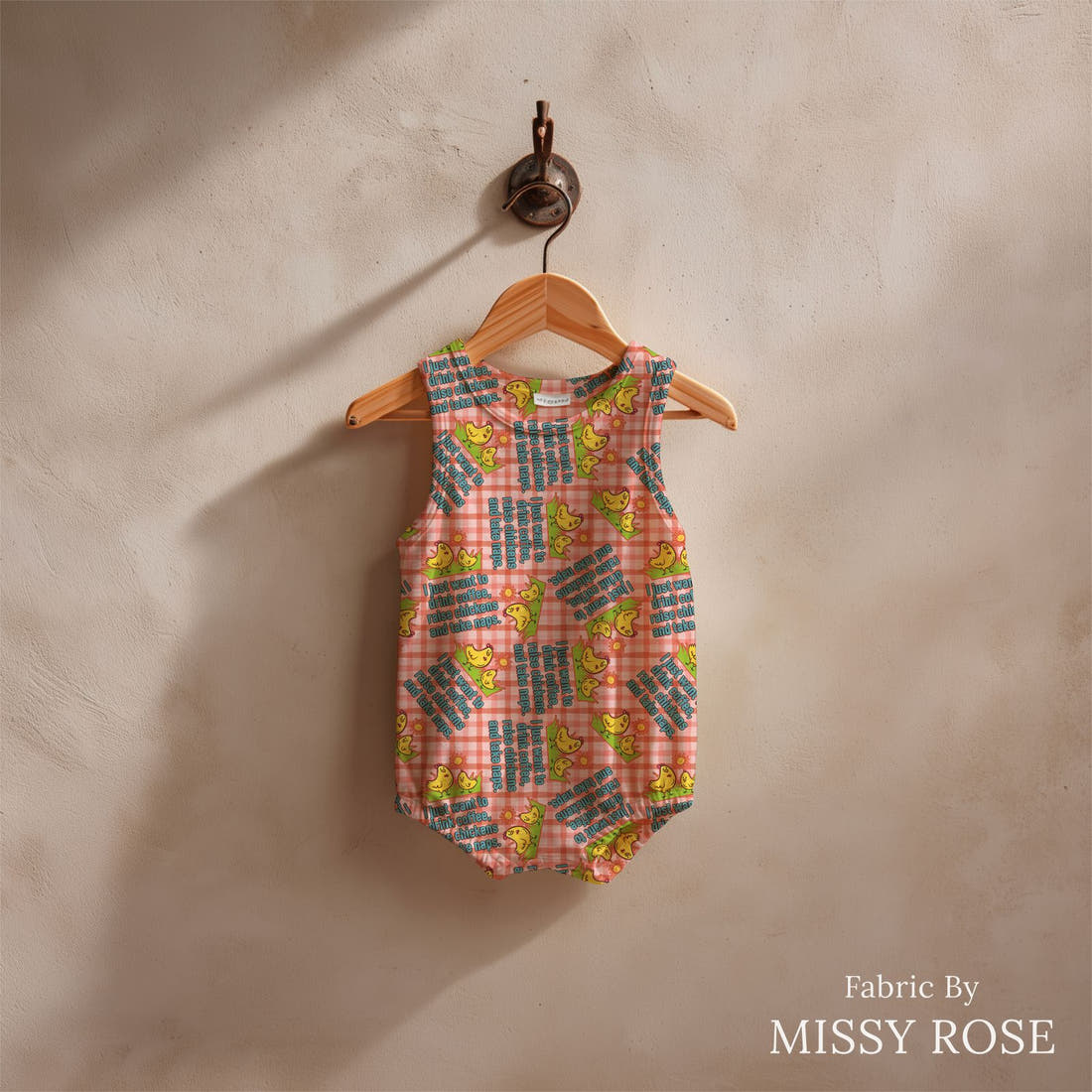 Design 606 Raise Chicken Fabric sewn into a baby romper – see how the print looks made up | Fabric by Missy Rose