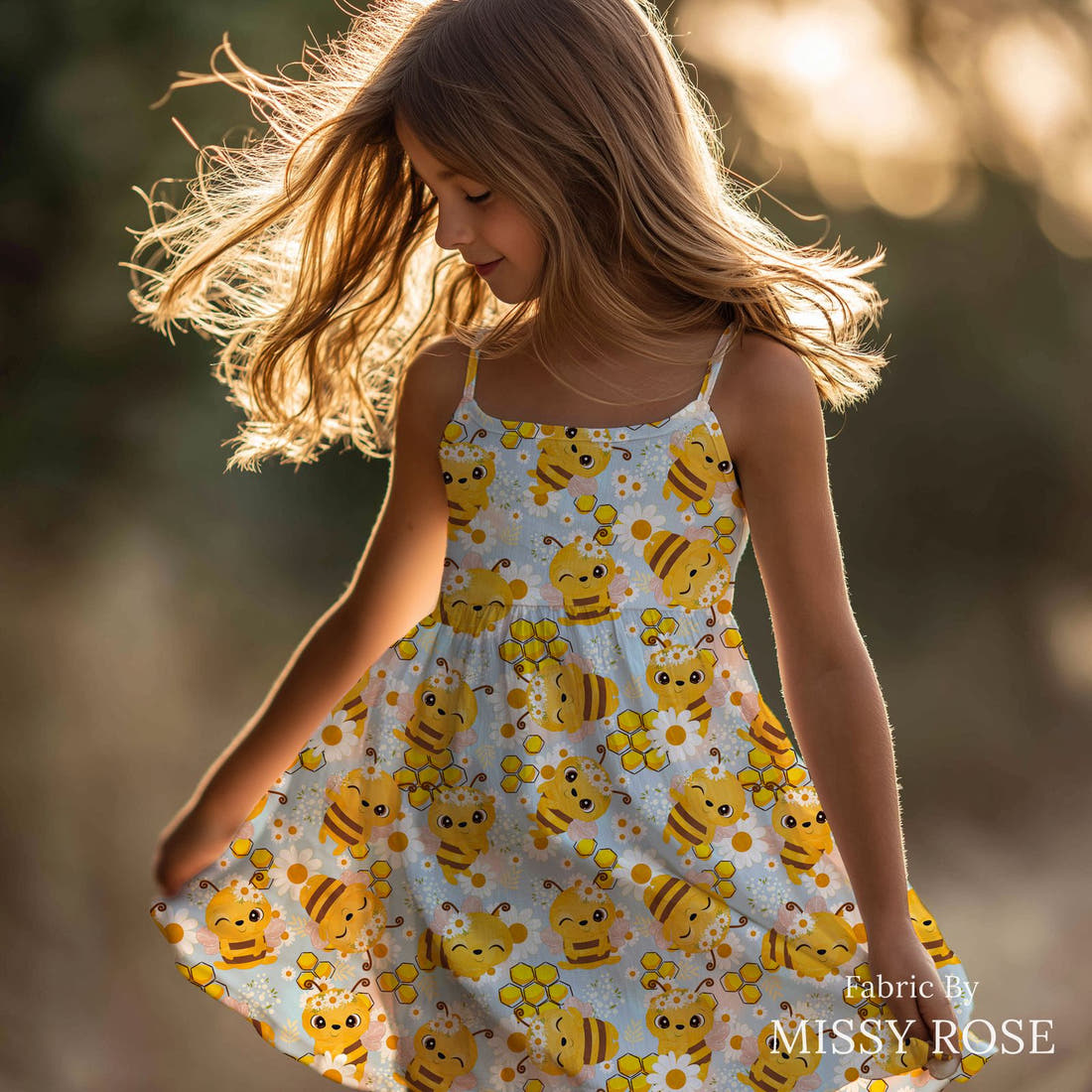 Design 637 Cute Honey Bee Fabric sewn into a girls' dress – see how the print looks made up | Fabric by Missy Rose