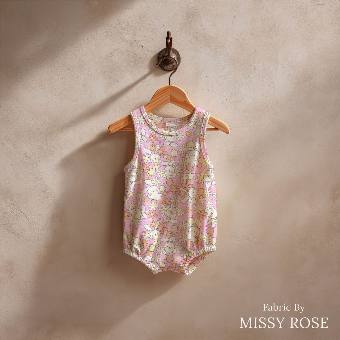 Design 638 Pink Bunny Fabric sewn into a baby romper – see how the print looks made up | Fabric by Missy Rose