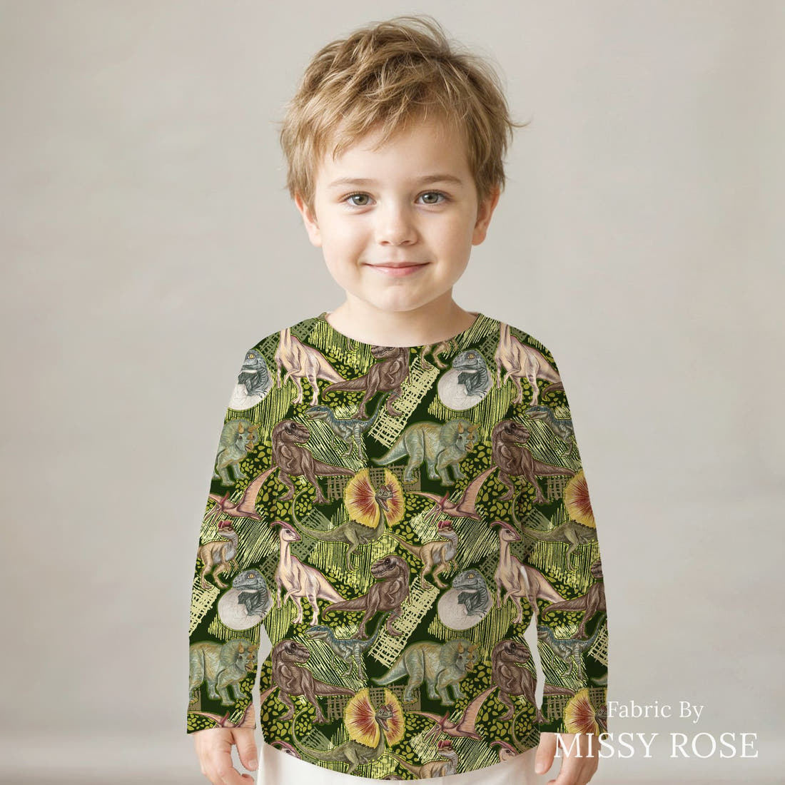 Design 649 Green Dino Fabric sewn into a kids' long sleeve top – see how the print looks made up | Fabric by Missy Rose