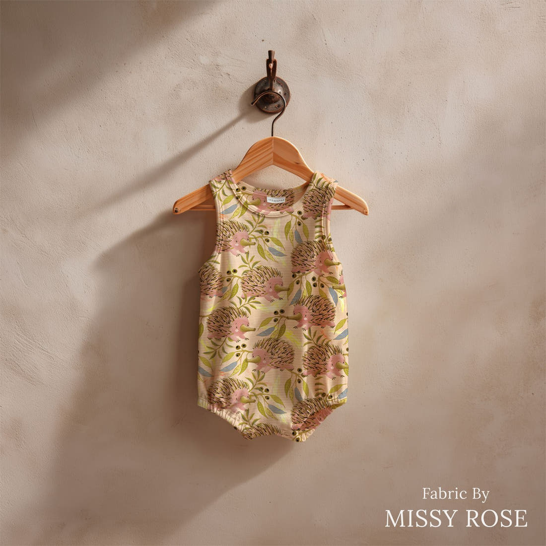 Design 652 Echidna Fabric sewn into a baby romper – see how the print looks made up | Fabric by Missy Rose