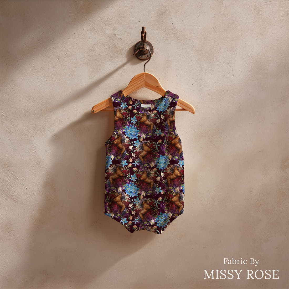 Design 661 Maroon Horse Fabric sewn into a baby romper – see how the print looks made up | Fabric by Missy Rose