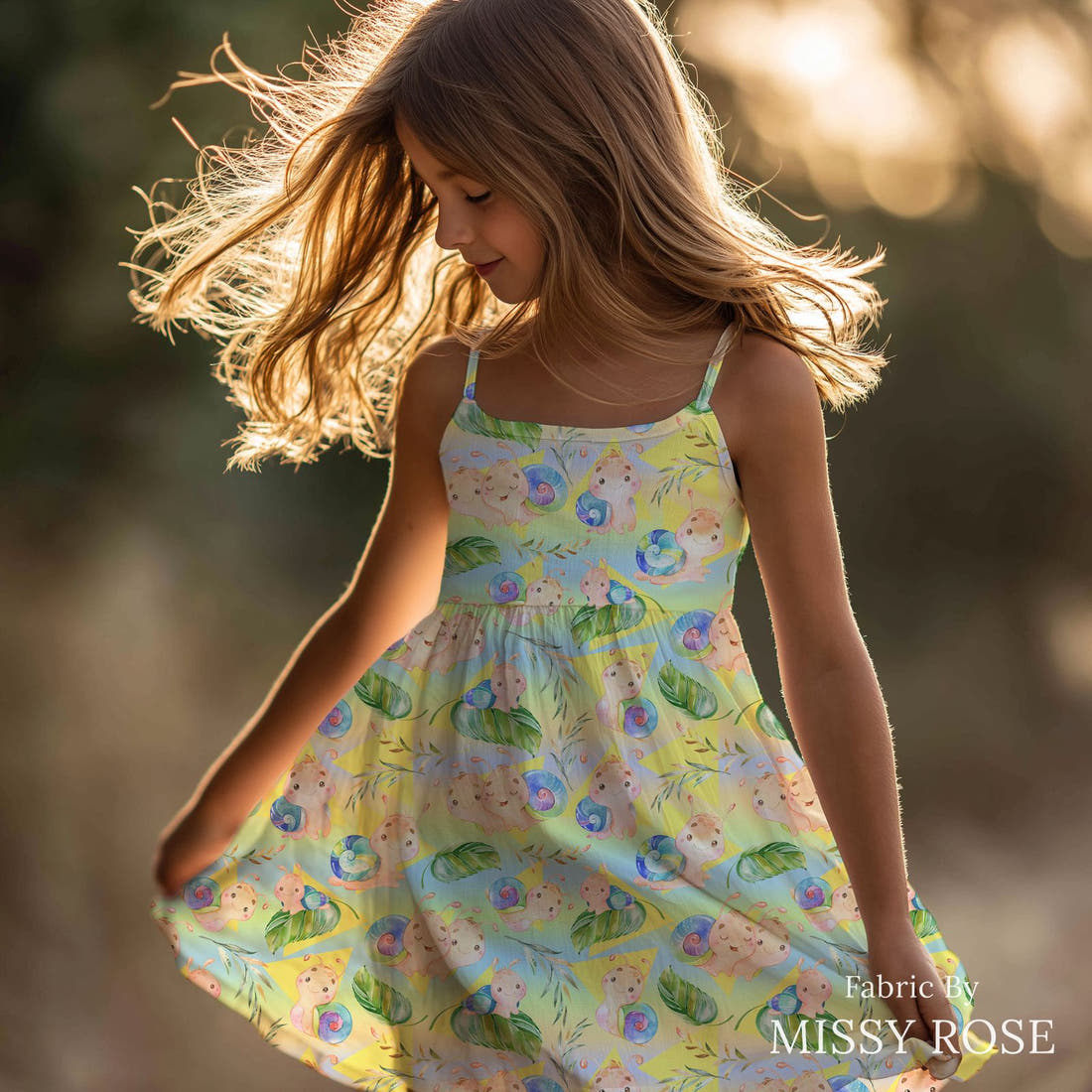 Design 672 Rainbow Snails Fabric sewn into a girls' dress – see how the print looks made up | Fabric by Missy Rose