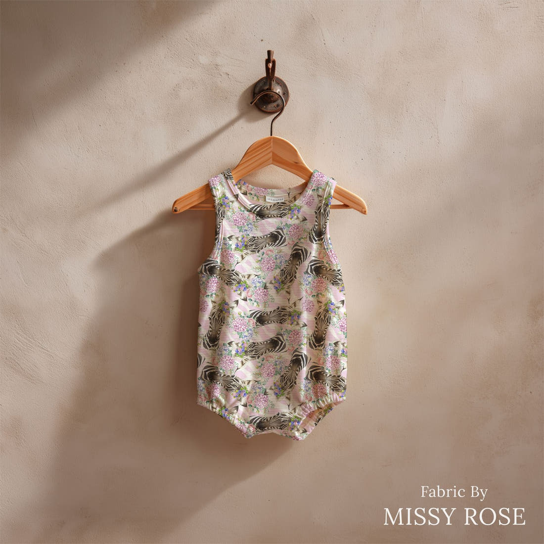 Design 679 Cute Zebra Fabric sewn into a baby romper – see how the print looks made up | Fabric by Missy Rose
