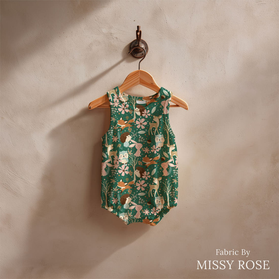 Design 682 Woodland Fabric sewn into a baby romper – see how the print looks made up | Fabric by Missy Rose