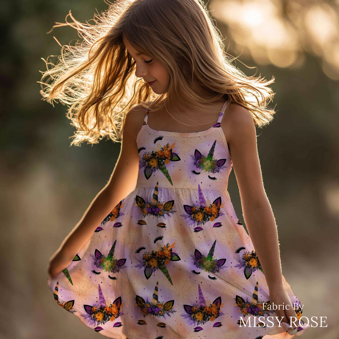 Design 688 Halloween Unicorn Fabric sewn into a girls' dress – see how the print looks made up | Fabric by Missy Rose
