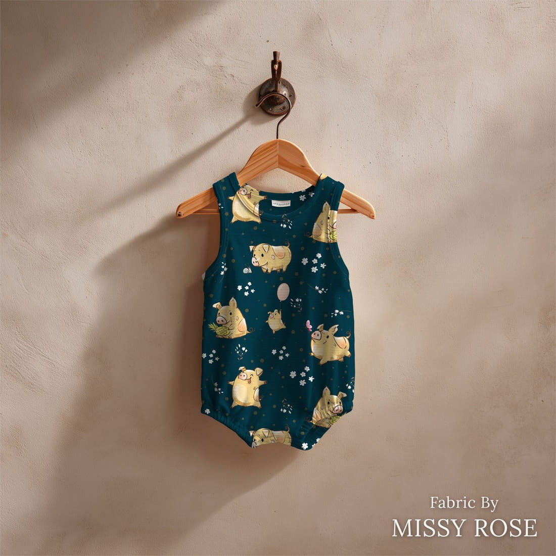 Design 70 Navy Pigs Fabric sewn into a baby romper – see how the print looks made up | Fabric by Missy Rose