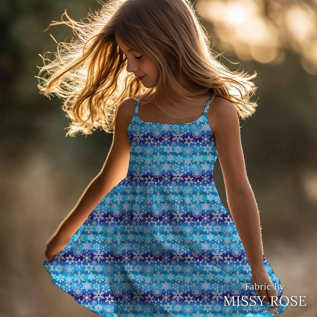 Design 75 Snowflake Fabric sewn into a girls' dress – see how the print looks made up | Fabric by Missy Rose