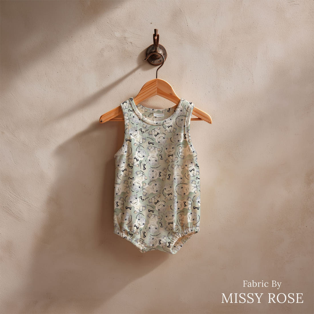 Design 807 Grey Hippo Fabric sewn into a baby romper – see how the print looks made up | Fabric by Missy Rose