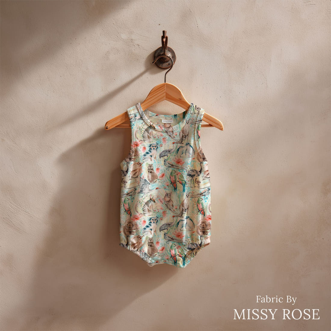 Design 812 Blue Australian Animal Fabric sewn into a baby romper – see how the print looks made up | Fabric by Missy Rose