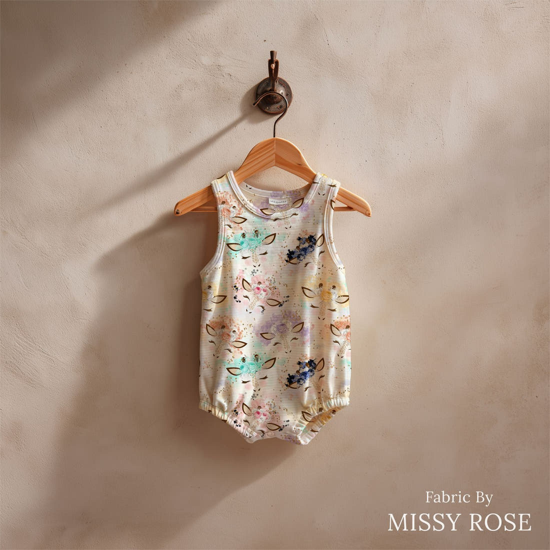 Design 817 Giraffe Fabric sewn into a baby romper – see how the print looks made up | Fabric by Missy Rose