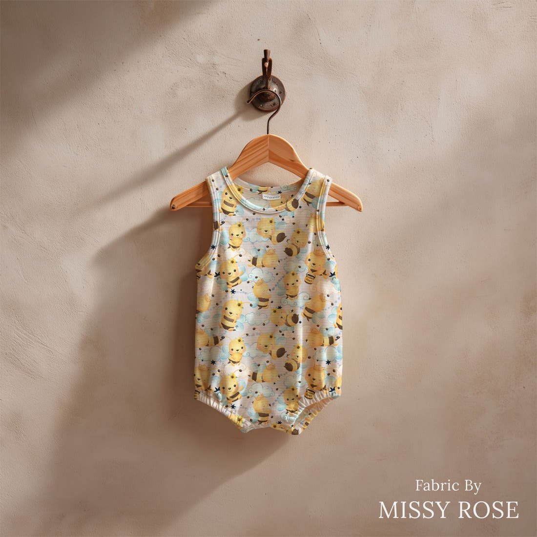 Design 826 Honey Bee Fabric sewn into a baby romper – see how the print looks made up | Fabric by Missy Rose