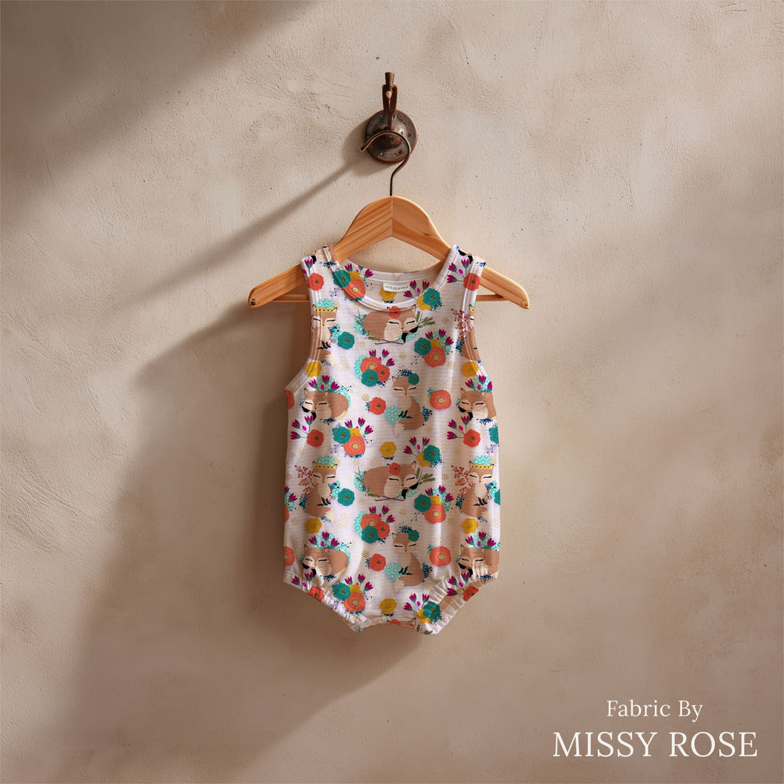 Design 833 Purple Fox Fabric sewn into a baby romper – see how the print looks made up | Fabric by Missy Rose