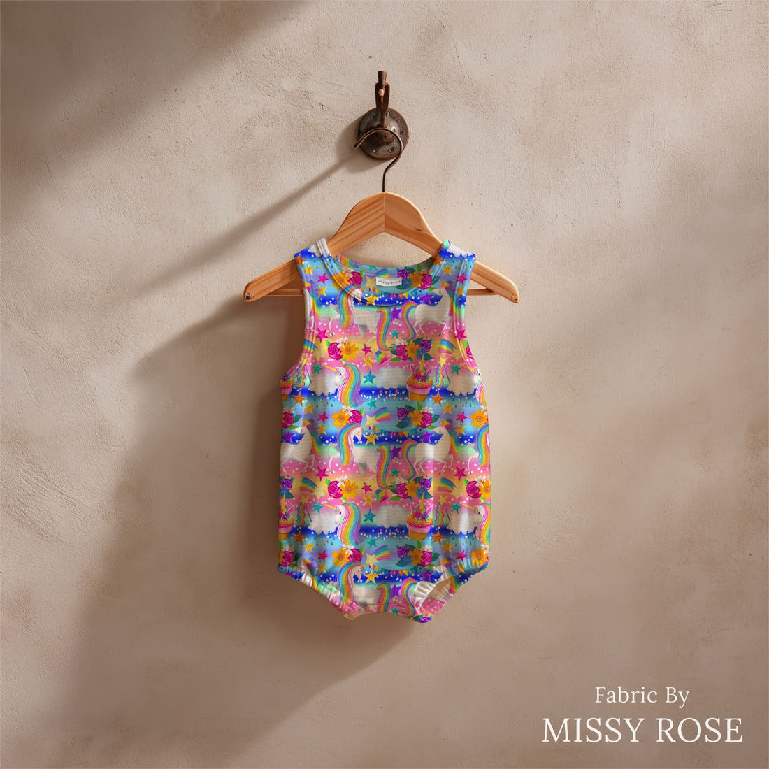 Design 835 Rainbow Unicorn Fabric sewn into a baby romper – see how the print looks made up | Fabric by Missy Rose