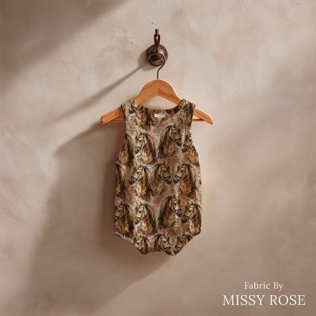 Design 843 Brown Horse Fabric sewn into a baby romper – see how the print looks made up | Fabric by Missy Rose