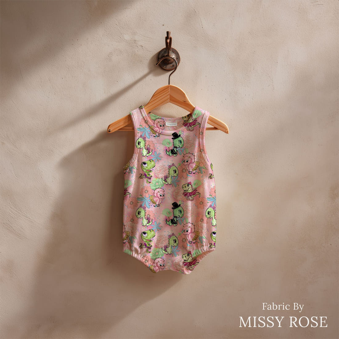 Design 846 Valentines Dinosaur Fabric sewn into a baby romper – see how the print looks made up | Fabric by Missy Rose