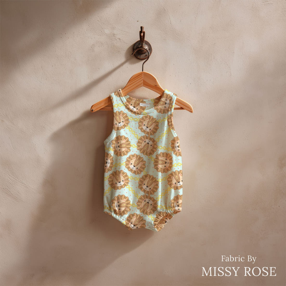 Design 853 Cute Lions Fabric sewn into a baby romper – see how the print looks made up | Fabric by Missy Rose