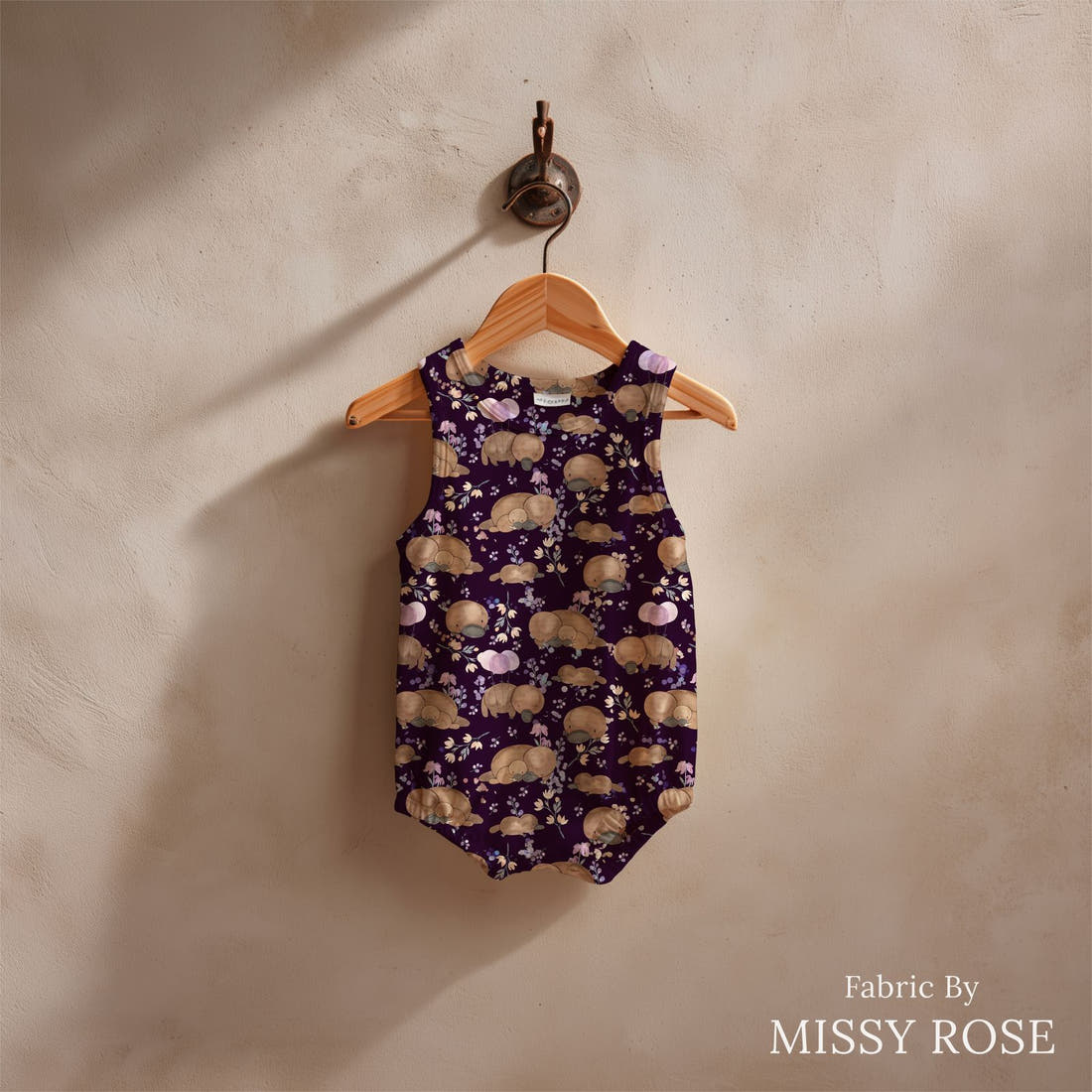 Design 869 Navy Platypus Fabric sewn into a baby romper – see how the print looks made up | Fabric by Missy Rose