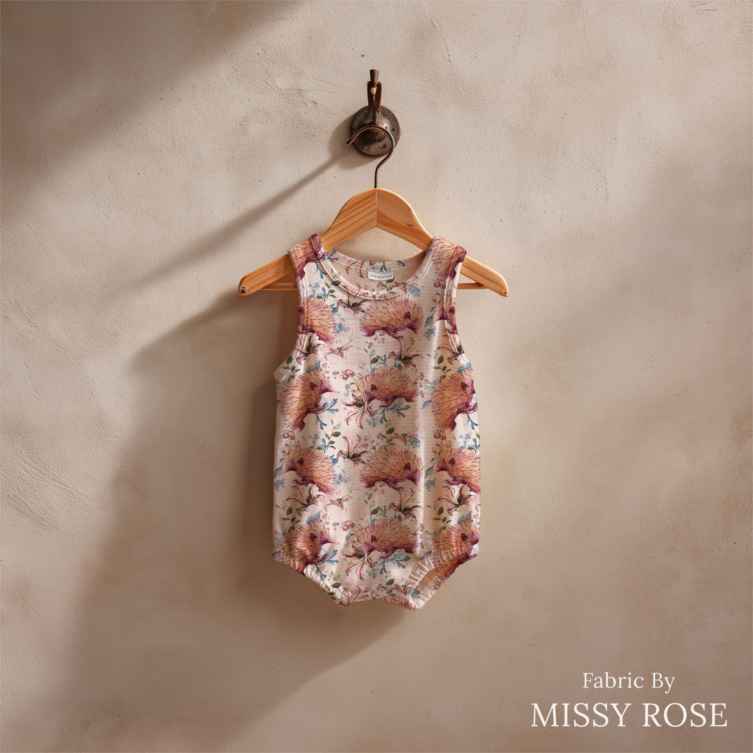 Design 884 Echidna Fabric sewn into a baby romper – see how the print looks made up | Fabric by Missy Rose