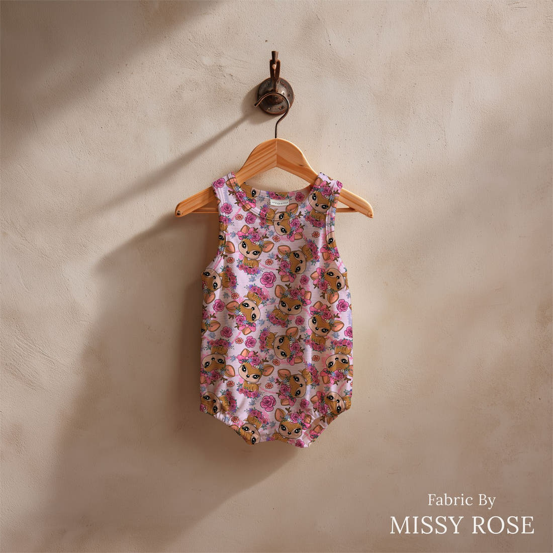 Design 888 Purple Deer Fabric sewn into a baby romper – see how the print looks made up | Fabric by Missy Rose