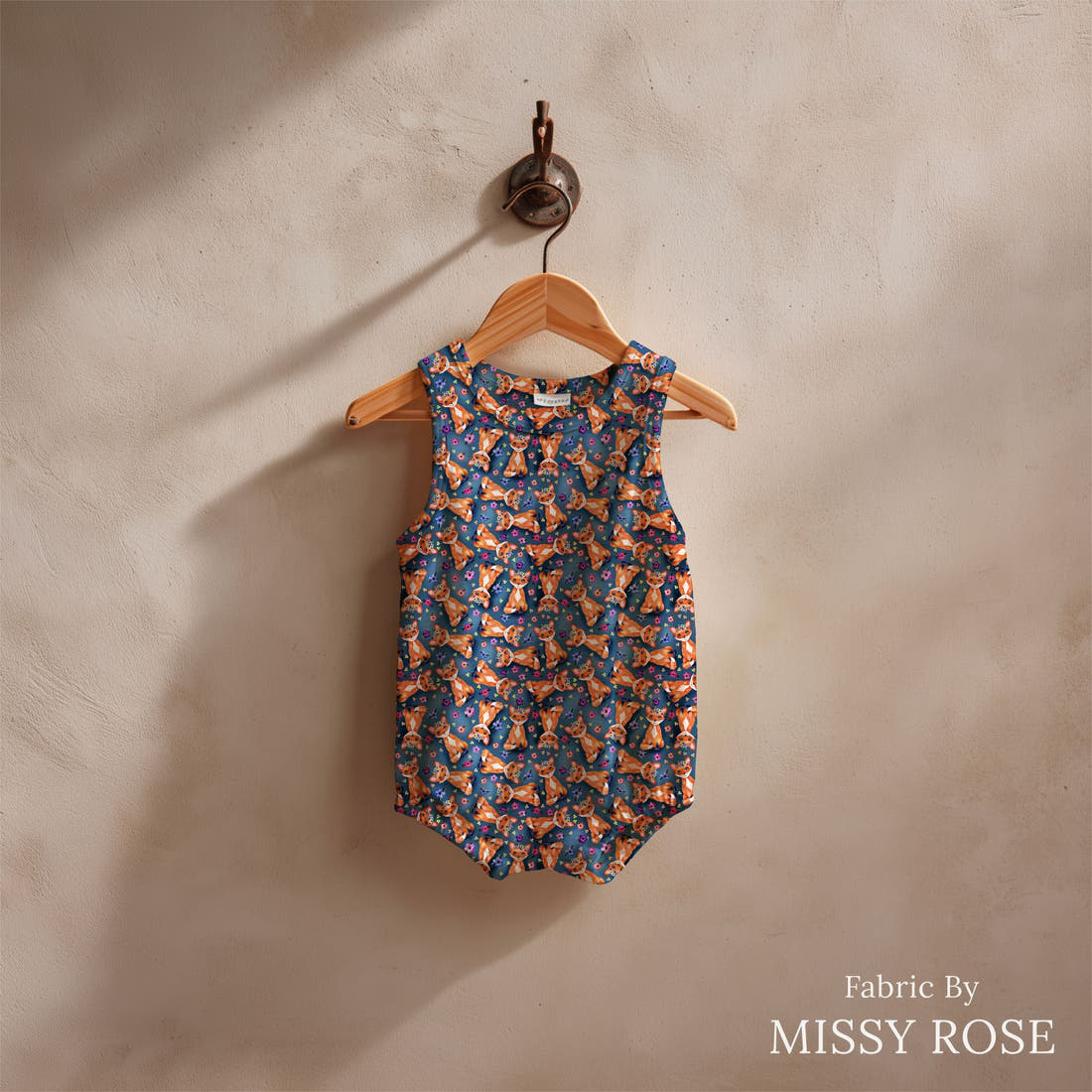 Design 907 Navy Fox Fabric sewn into a baby romper – see how the print looks made up | Fabric by Missy Rose