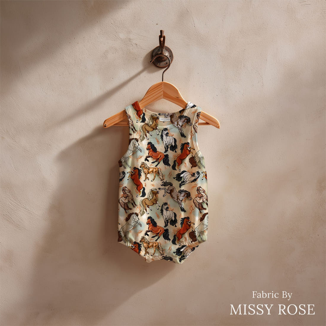 Design 953 Neutral Horse Fabric sewn into a baby romper – see how the print looks made up | Fabric by Missy Rose