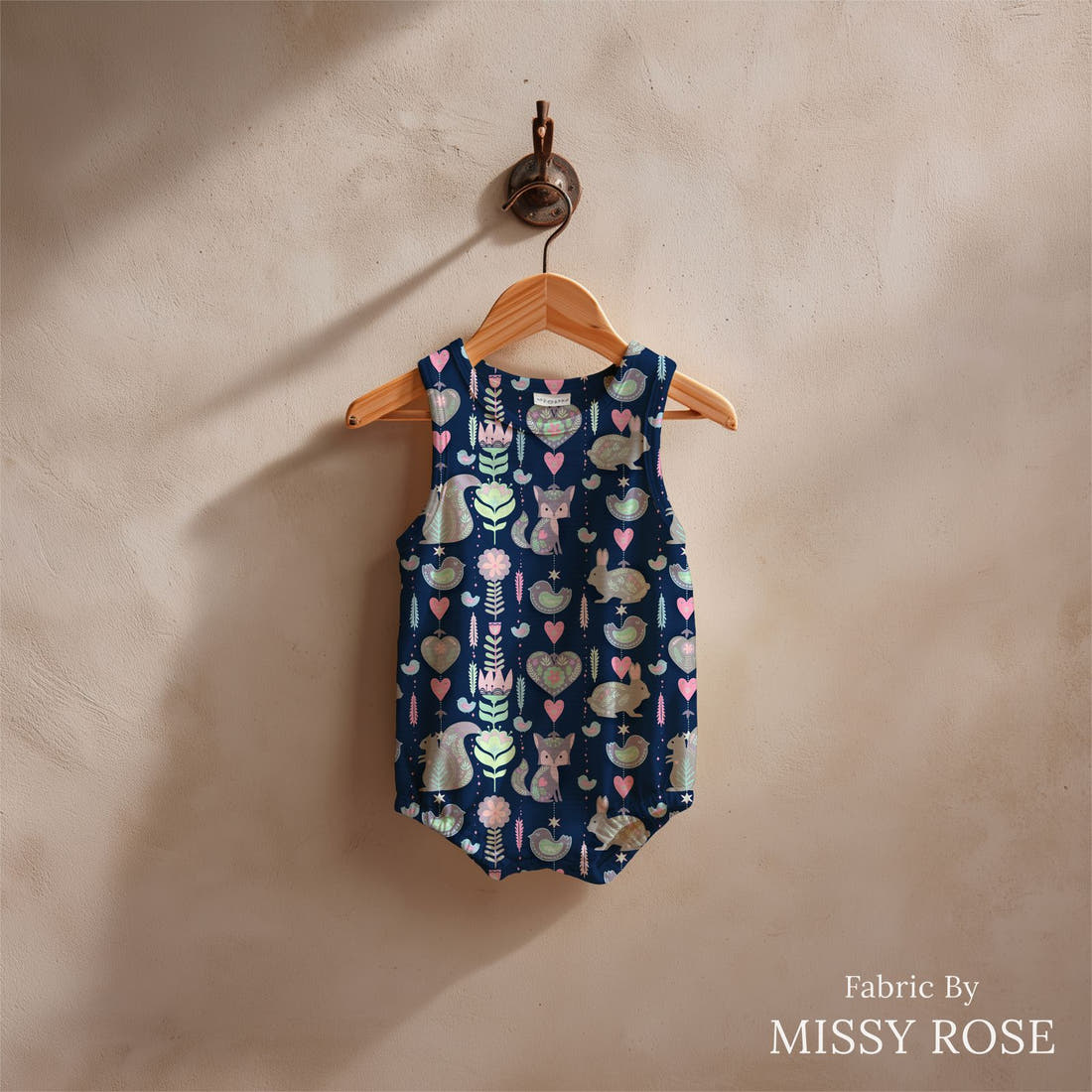 Design 999 Navy Bunny Fabric sewn into a baby romper – see how the print looks made up | Fabric by Missy Rose